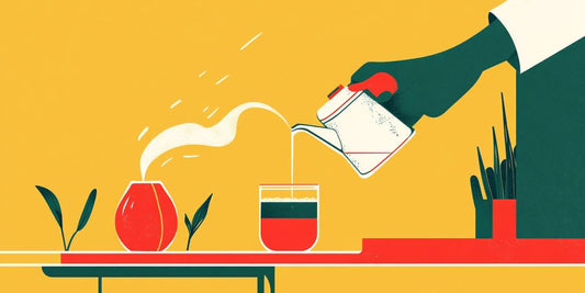 Hand pouring a drink into a glass on a table.